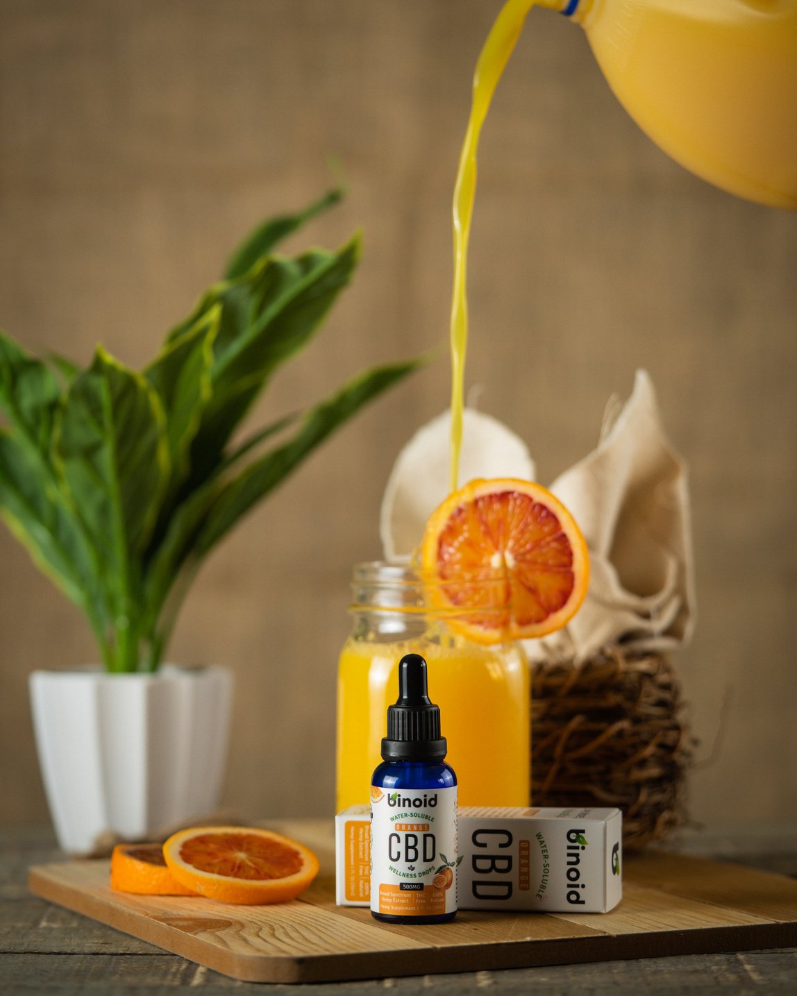 Orange and CBD Product Beside Plant